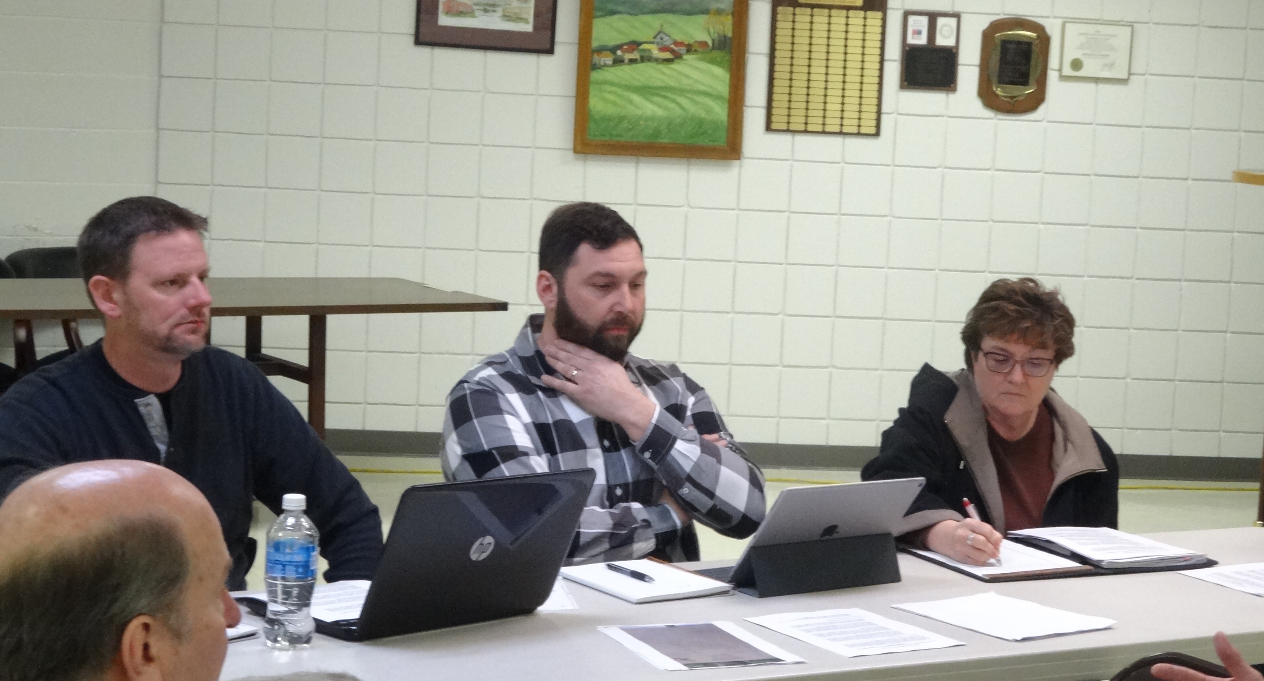 Mike Schiska, left, and Dave DeJoy of Brookfield Youth Baseball and Softball Inc. and Judy Radachy of Trumbull County Adaptive Baseball are shown at a meeting with Brookfield trustees.