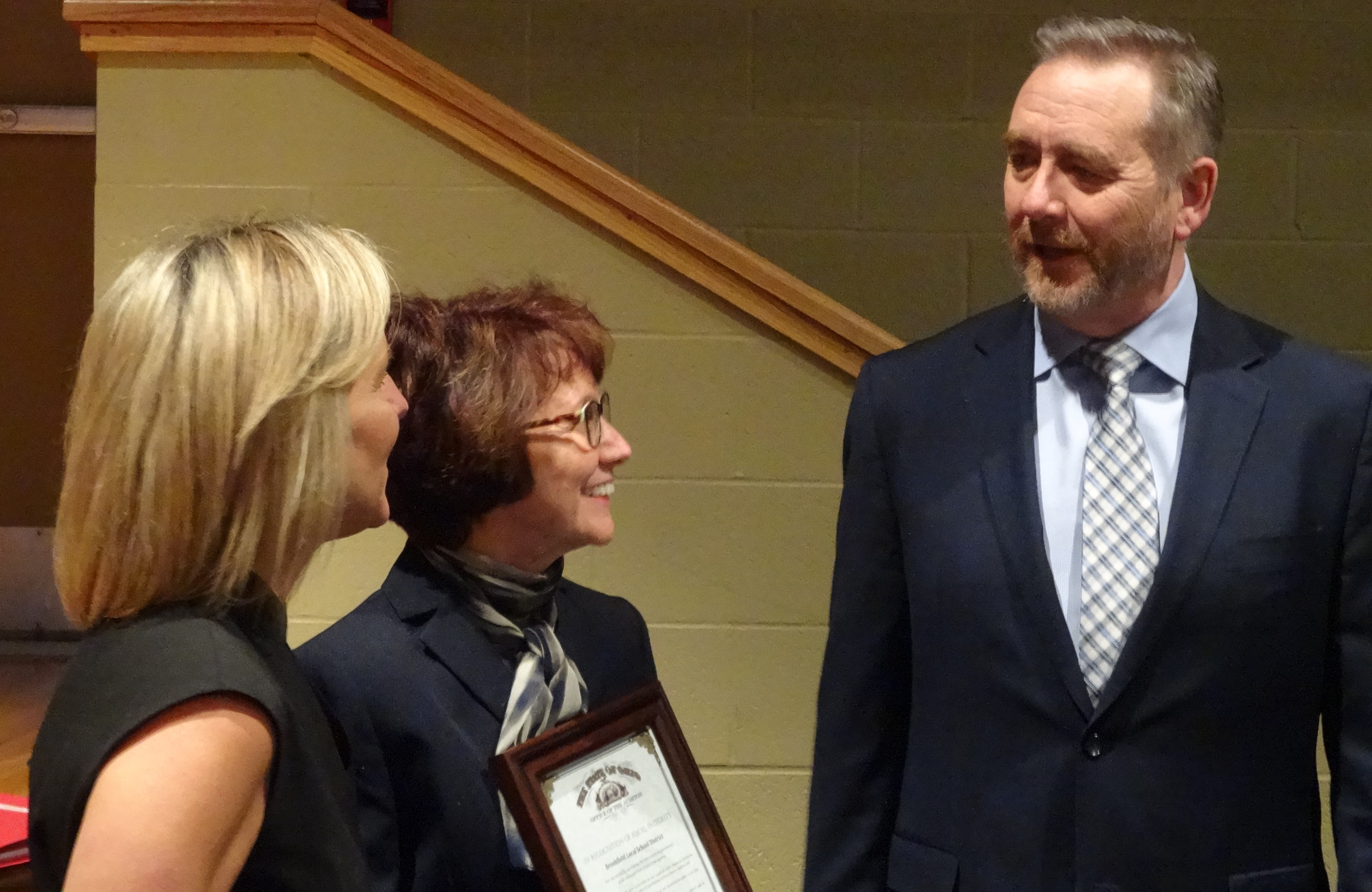 Ohio Auditor of State Dave Yost is shown with Brookfield Board of Education President Kelly Carrier, left, and school Superintendent Velina Jo Taylor.