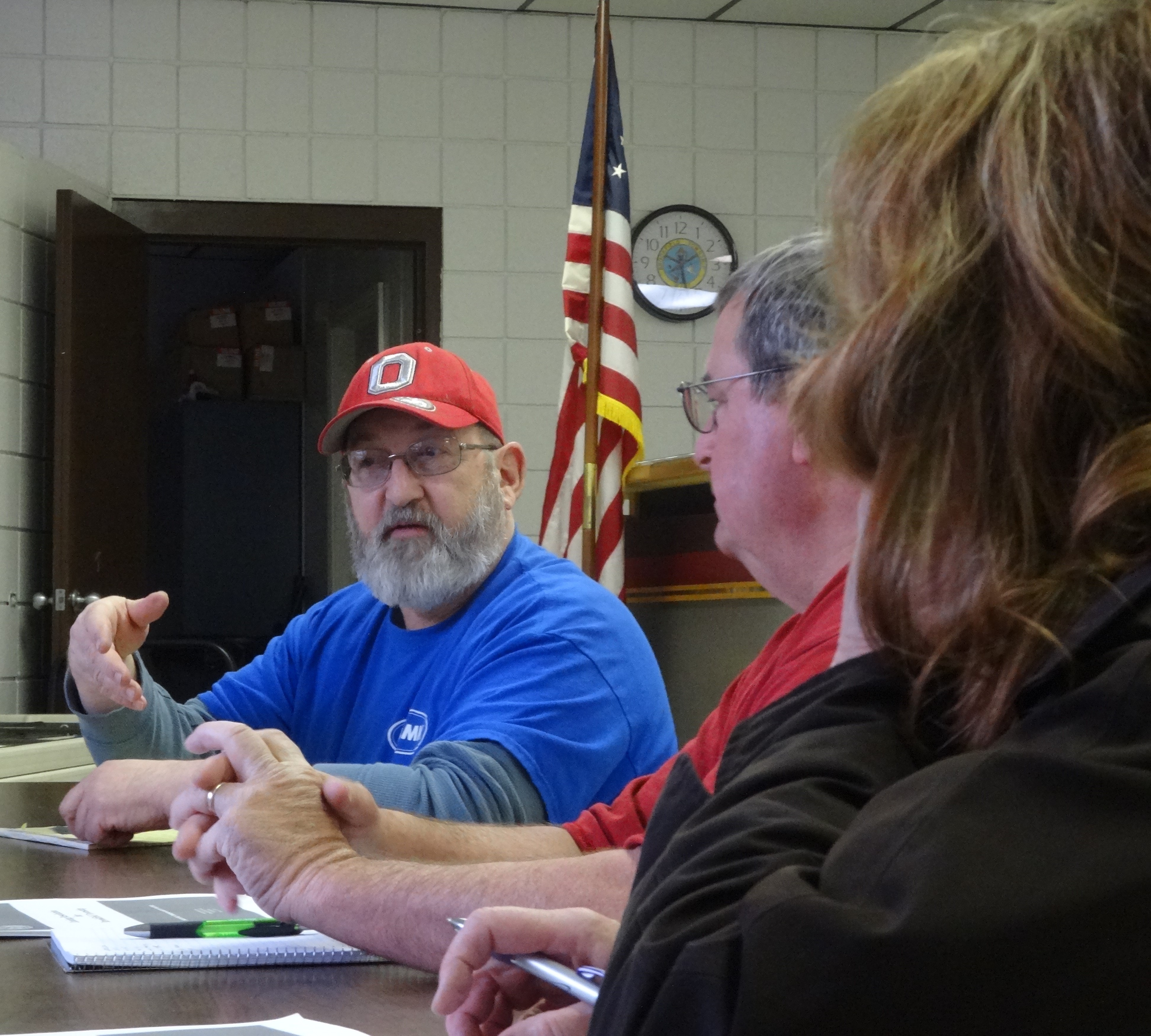 Brookfield Township Zoning Commission Chairman Todd Fencyk makes a point as Chuck Fizet and Noelle Honel look on.