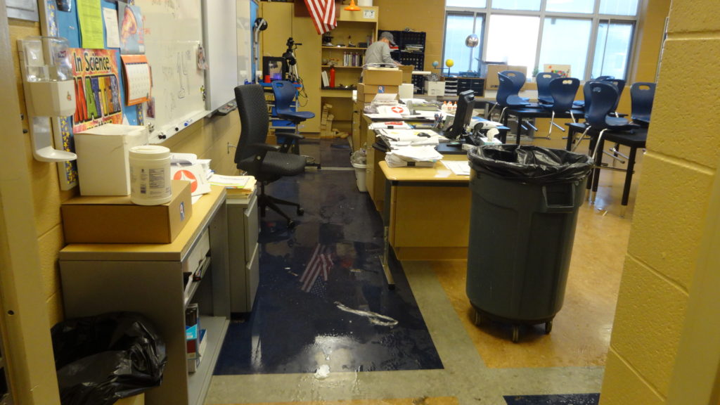Teacher Nate Berry cleans up his classroom.