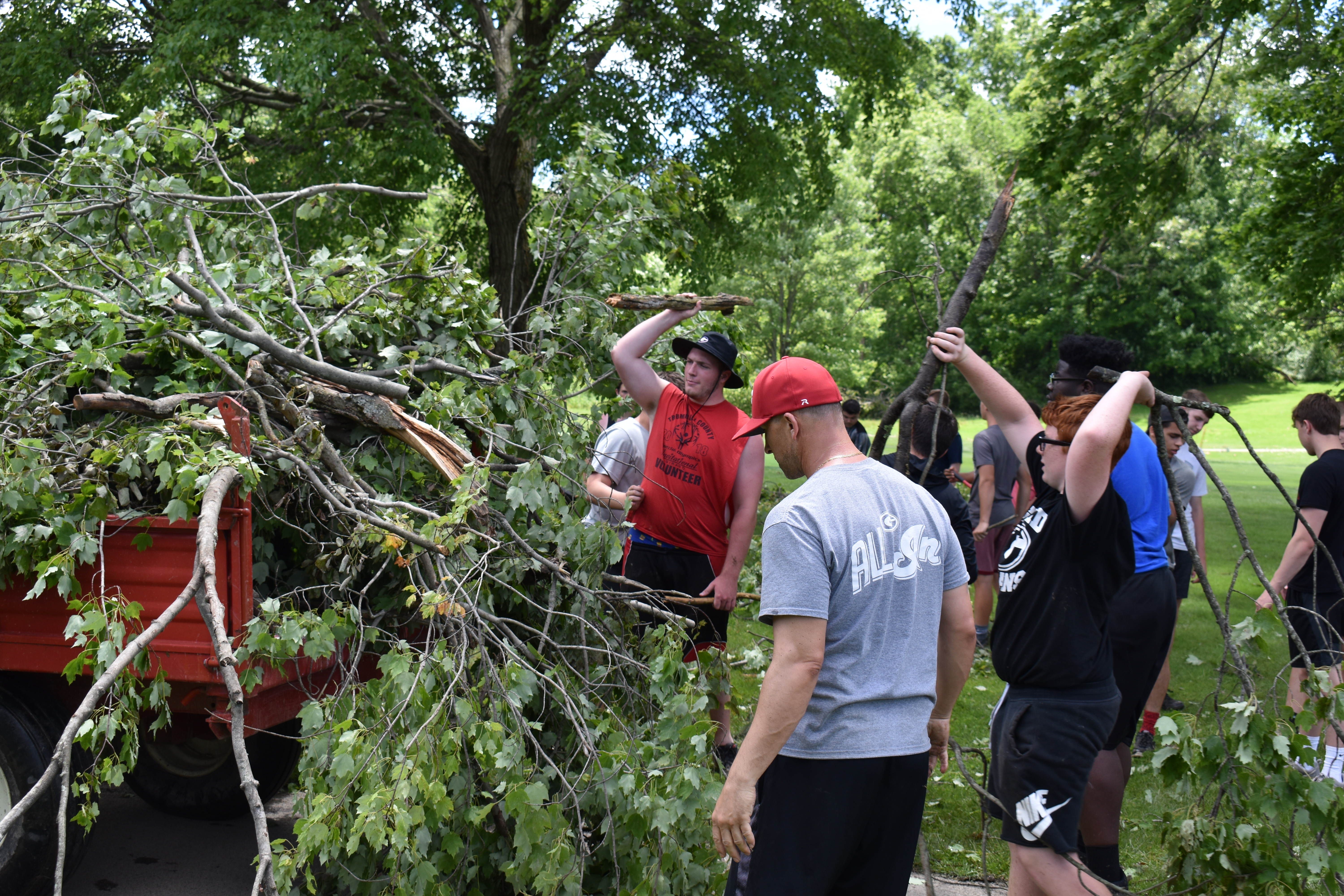 Girard High School athletes load up debris at Yankee Run Golf Course.
