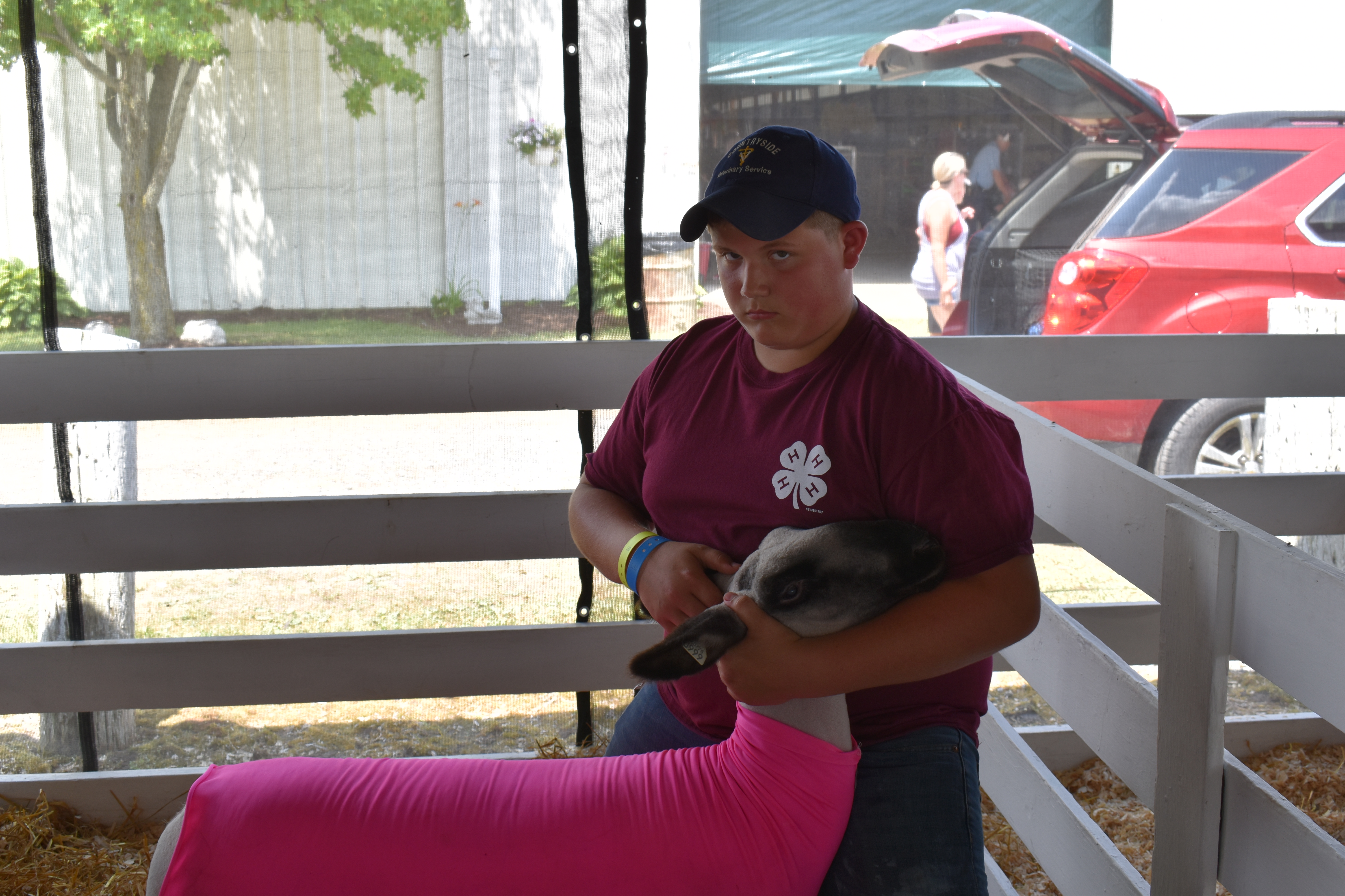 Justin Hall of Brookfield poses with one of his Hampshire-Suffolk lambs.