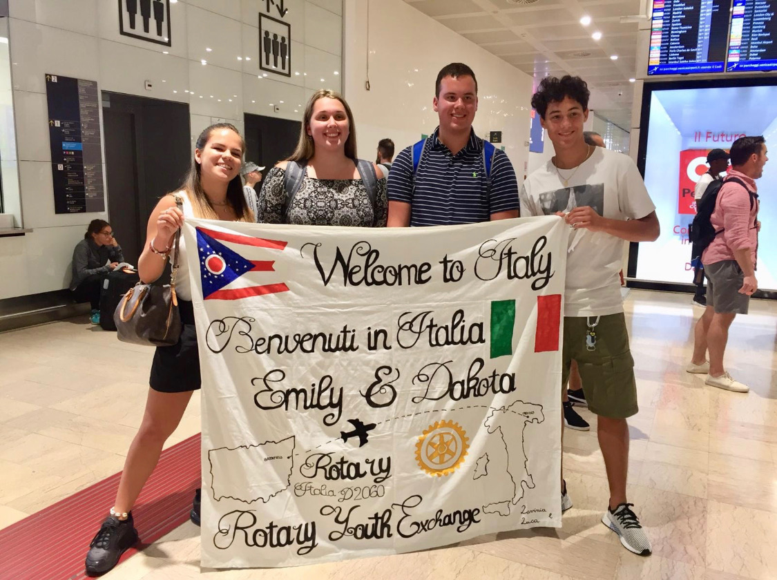 Dakota and Emily Obermiyer, center, are greeted upon their arrival in Italy by their hosts, Lavinia Paliani and Luca Pedrini. Contributed photo.