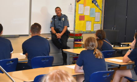 Board approves pact for cop in school