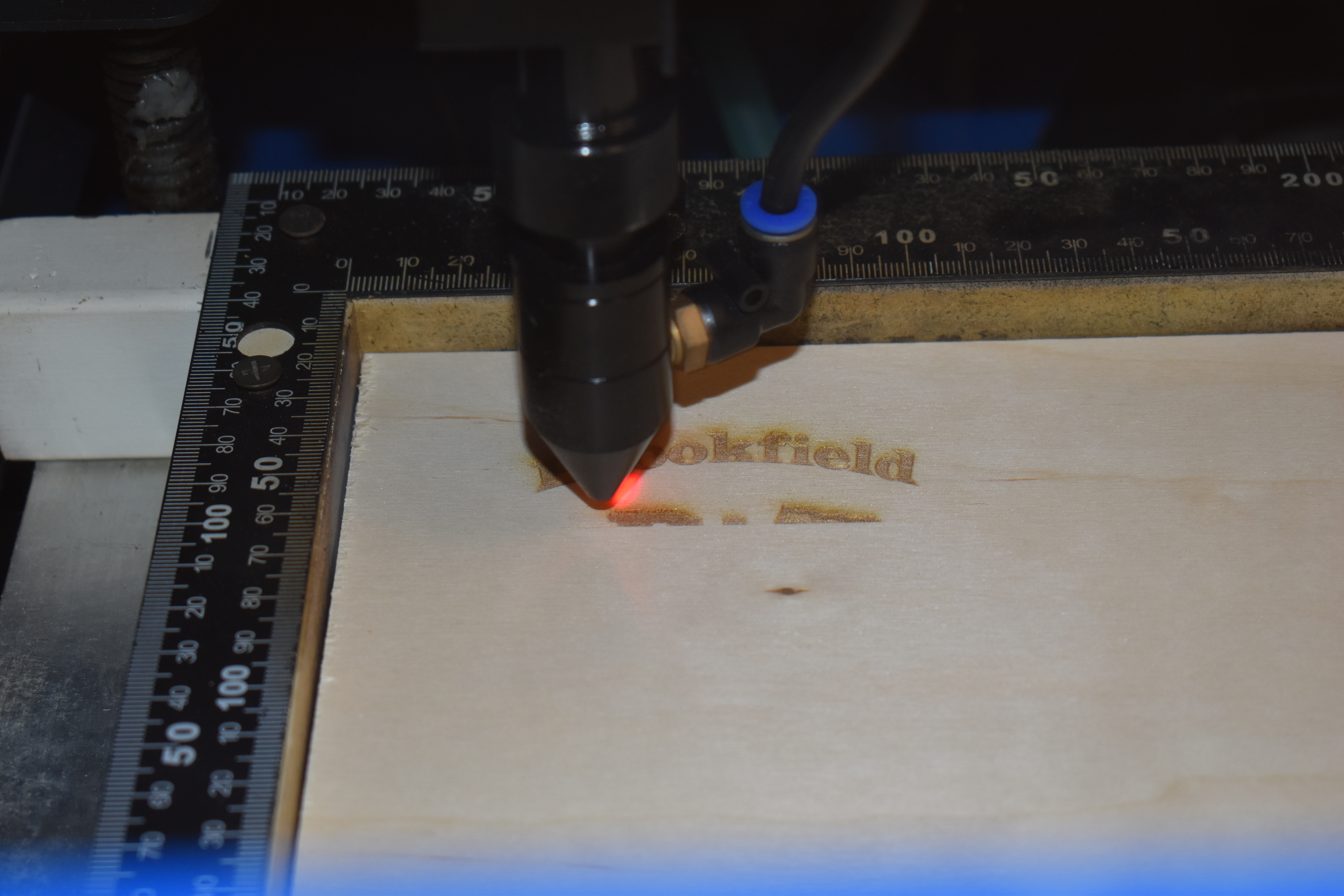 A laser engraver in action.