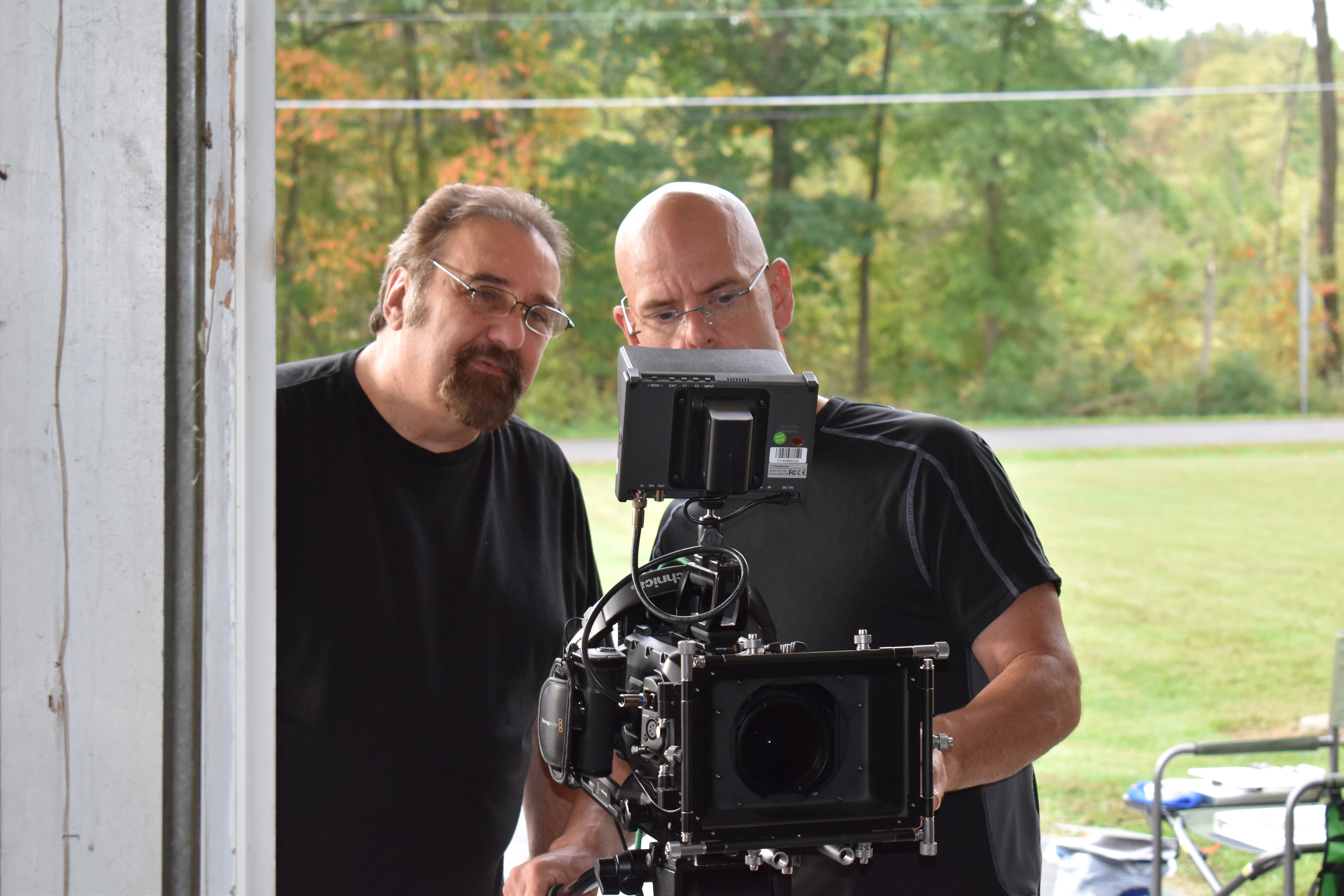 "Finding Purpose: Road to Redemption" director John Reign and cinematographer Bill Schotten review the playback of a scene they have just shot.