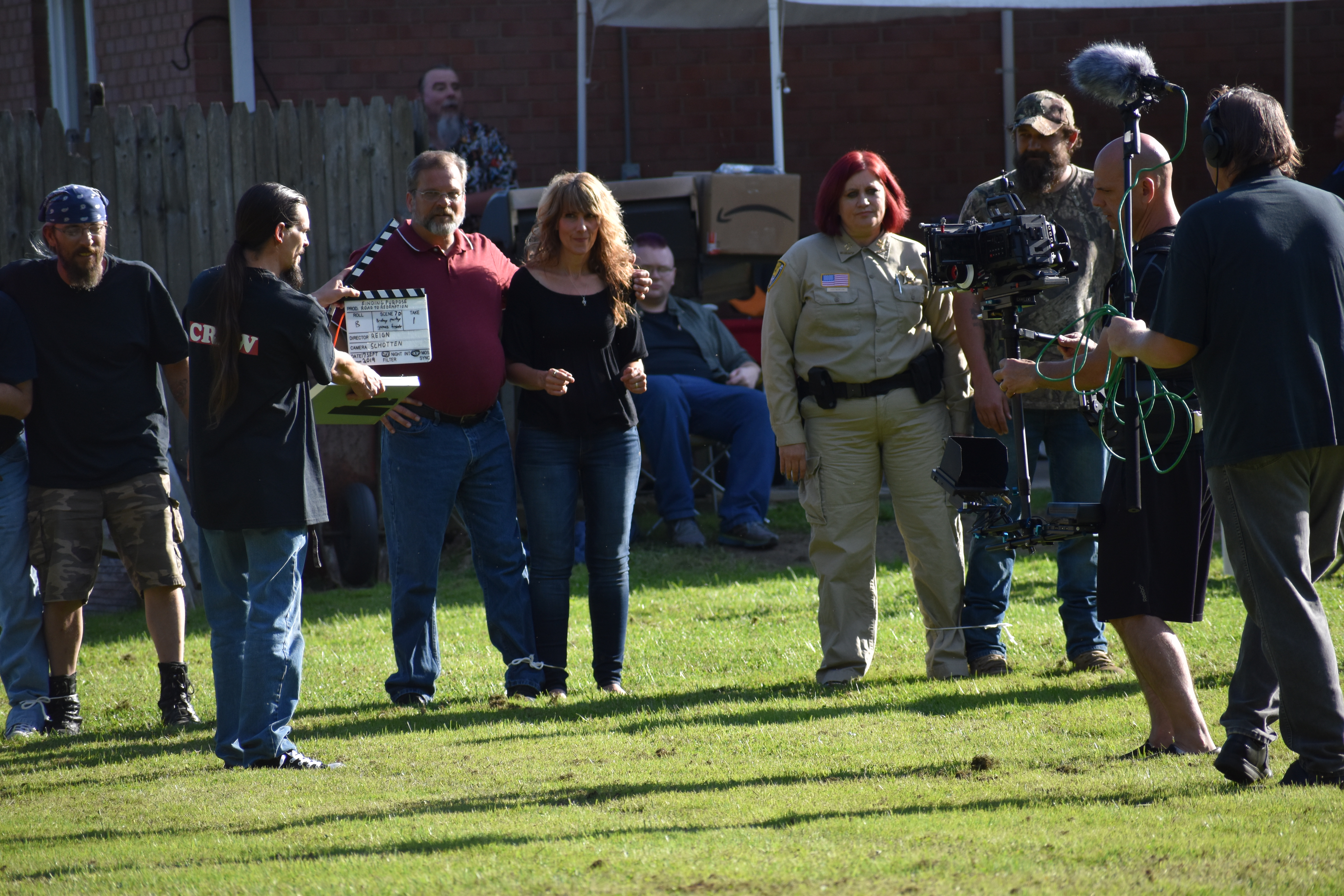 Chris Goff holds the clapperboard to set up a shot. Also shown are, from left, Ross Carlo, Ed McIntosh, Heidi Wlodarski, Milly Phipps, Charles Wedge, Bill Schotten and William Long.