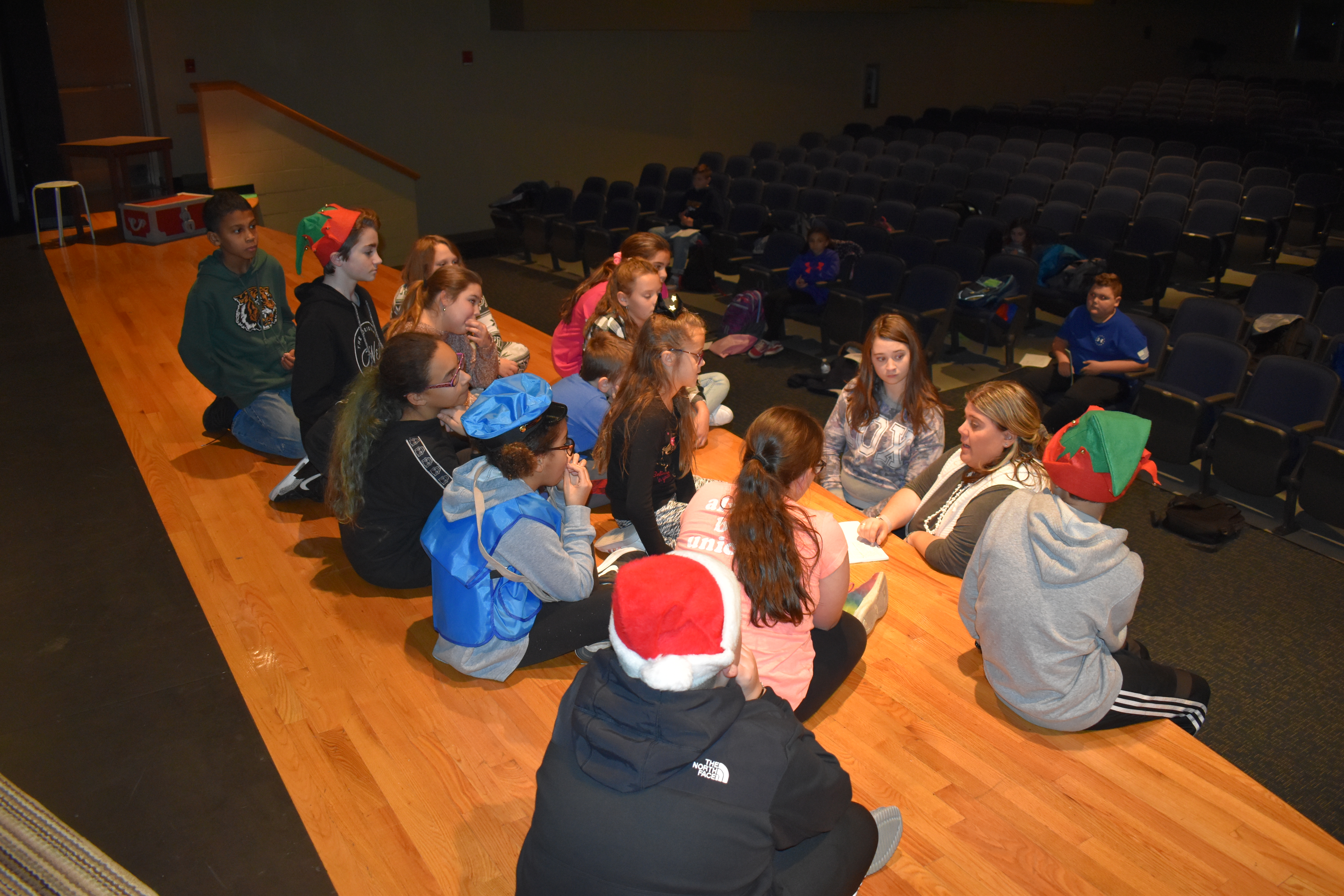 Brookfield Drama Club adviser Megan Rodgers goes over notes after a run through of “How Santa Got His Christmas Tree.”
