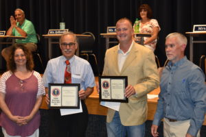 Ed D'Onofio, second from left, who is representing Mr. D's Delicious Fresh Foods, and Bill O'Brien, second from right, representing Declan Construction, are honored by Brookfield Local School District and the Ohio School Boards Association for their contributions to the school district. Michael Martin Distributing Inc. also was honored, but no representative attended the meeting. Board Vice President Melissa Sydlowski is at left, and Supt. Toby Gibson at right.