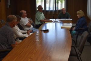 Hartford trustees Rebecca Whitman, right, and Phil Wilhelm, end of table, discuss fire protection with Brookfield officials, from left, Trustee Ron Haun, Fiscal Officer Dena McMullin, Trustee Gary Lees and Trustee Dan Suttles.