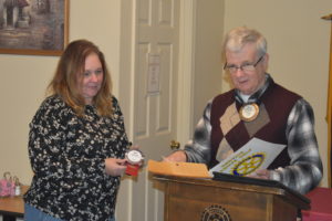 Brookfield Rotary Club President Elwood Walker presents the club's newest member, Amy Zell, who was installed Nov. 16.