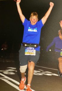 Shawna Fedorko, her injured knee wrapped, celebrates completing the New York City Marathon.