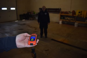 Brookfield Fire Capt. James Williamson holds a thermal imaging camera that shows Emily Stone's heat signature.