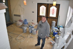Scott Thompson stands in what will be the lobby of a workshop for people with developmental disabilities in Masury.