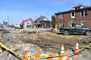 McKinley Industries LLC is shown demolishing three buildings that are on the site of a proposed gas station and convenience store in Masury. All of the buildings have now been razed.