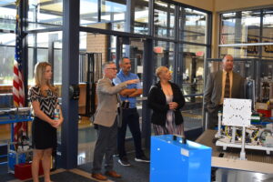 Brookfield school Supt. Toby Gibson, second from left, gives his fellow inductees into the Distinguished Alumni Hall of Fame a tour of the high school library and technology center. Also shown are, from left Kaitlyn Nasci Lang, Jason Straka, Dr. Marquita Hubbard Kemp and Dr. Joseph Zuhosky.