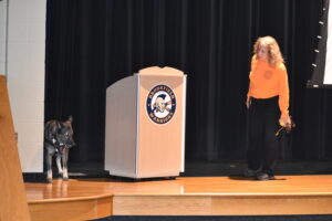 Kathy Ferrara watches as her K9 SOS dog searches for human remains at Safety Awareness Night.