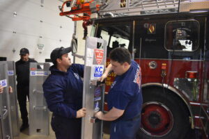 Dan Beauchene, right, and his brother, Dustin Beauchene, fit together grain bin rescue equipment the Brookfield Fire Department has acquired through a grant from the Trumbull County Farm Bureau. Firefighter Brian Stanley is at left.