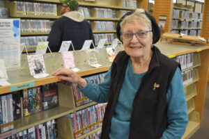 Elizabeth Boozer shows her contribution to the pop-up art show at the Brookfield Branch Library's 40th anniversary.