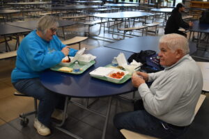 Fran and Wayne Tanner enjoy a pasta dinner at a fundraiser for Brookfield's school lunch debt. “We always support the schools,” Mrs. Tanner said.