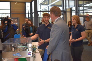 Troy Randall explains a piece of equipment in the Industry 4.0 lab to Lt. Gov. Jon Husted.