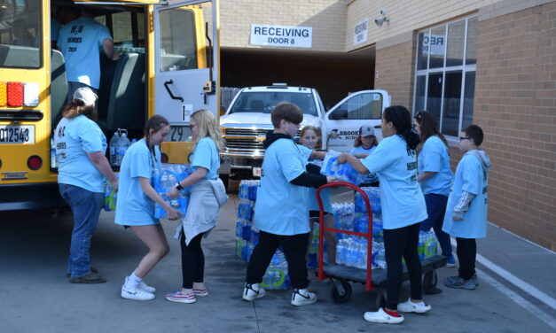 Donated water fills bus, truck