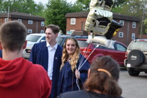 Derrick Double and Kaylie Miller celebrate their graduation after Brookfield High School's commencement ceremony.