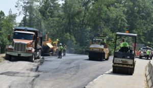 In this photo from July, workers pave one of the turnarounds of a restricted crossing U-turn on Route 62 at Bedford Road.
